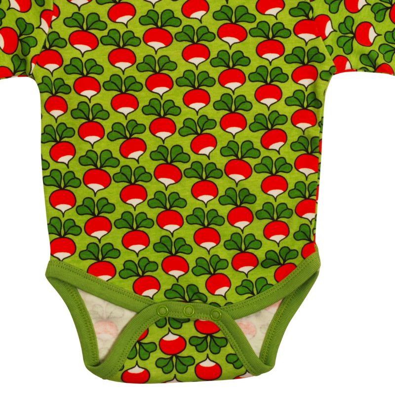 Green DUNS Sweden baby onesie with red and white radish pattern on a green background