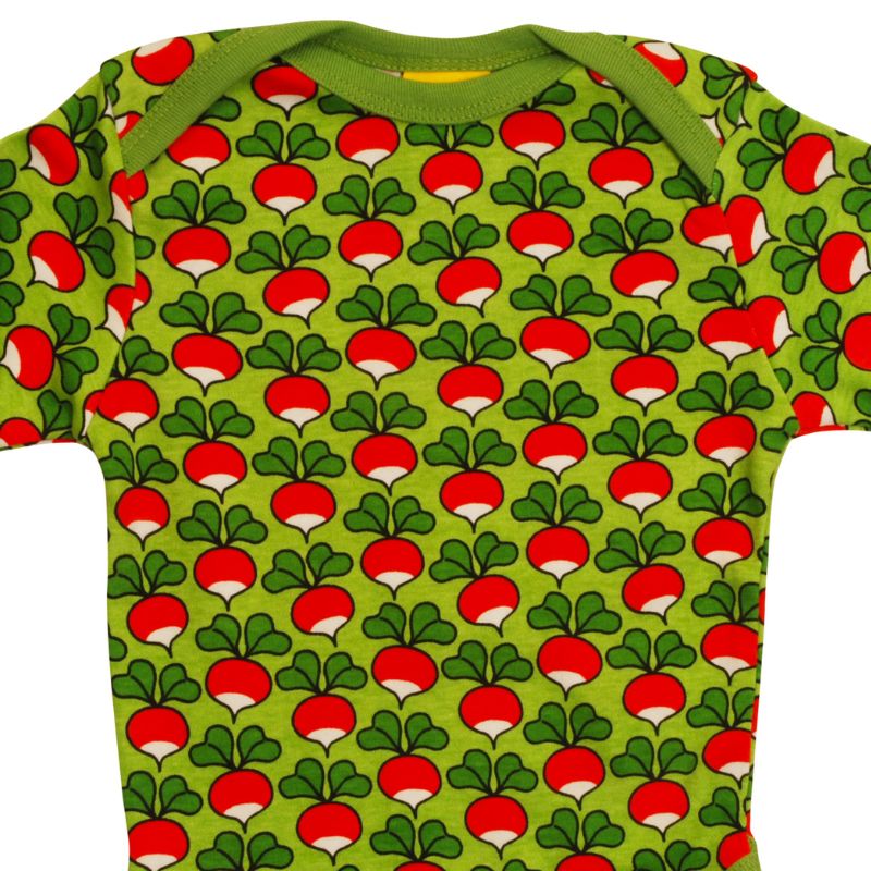 Green DUNS Sweden baby onesie with red and white radish pattern on a green background