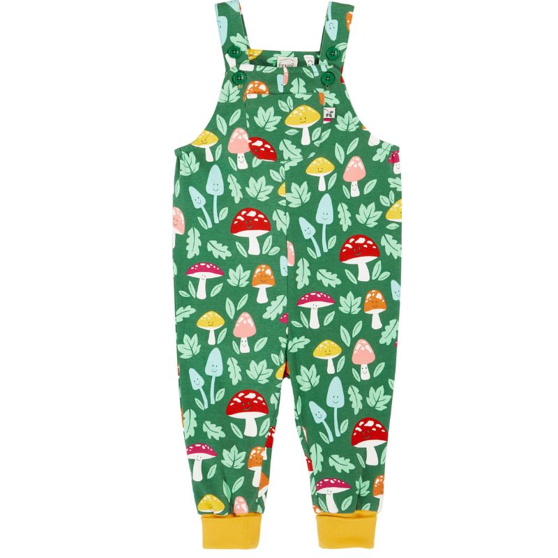 Green children&#39;s overalls with mushroom pattern on a white background