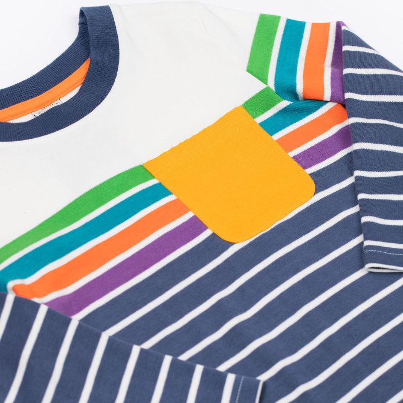 Close-up of a colorful striped shirt with a yellow pocket