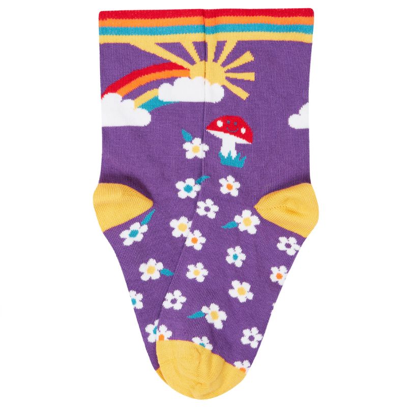 Colorful sock with mushrooms, flowers, and a rainbow on a purple background