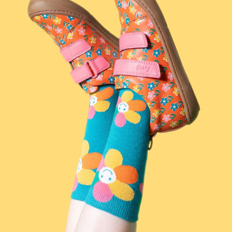 Three colorful socks with different patterns on a white background