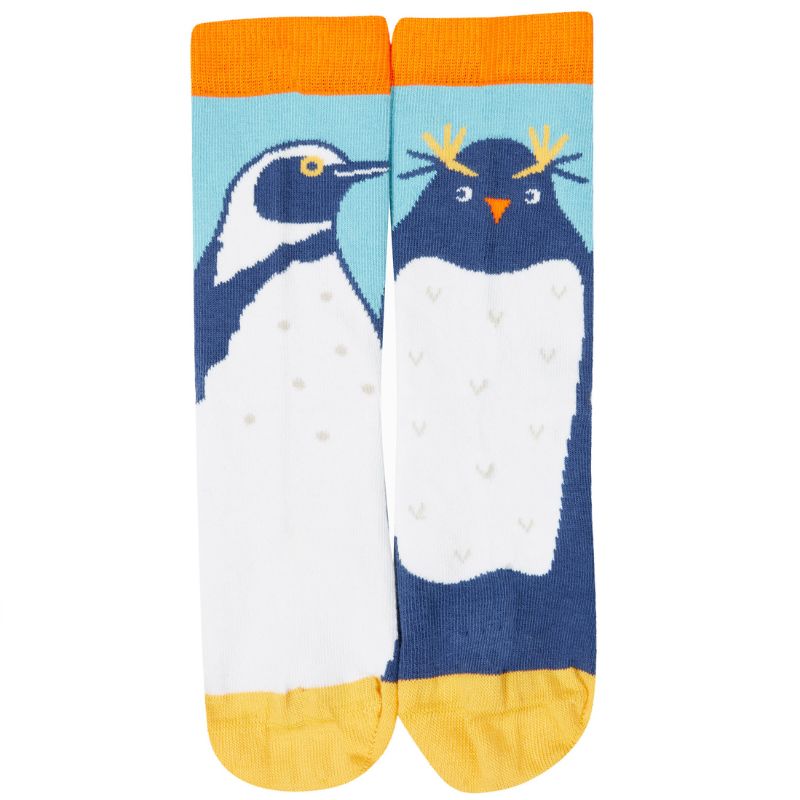 Penguin-themed socks with orange cuffs and toes on a white background