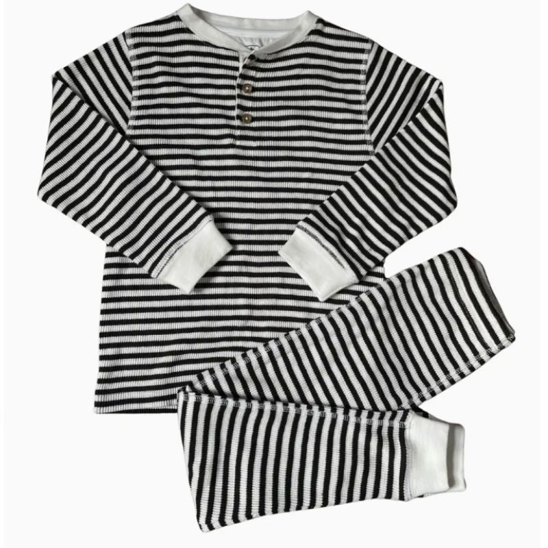 Black and white striped pajama set on a white background