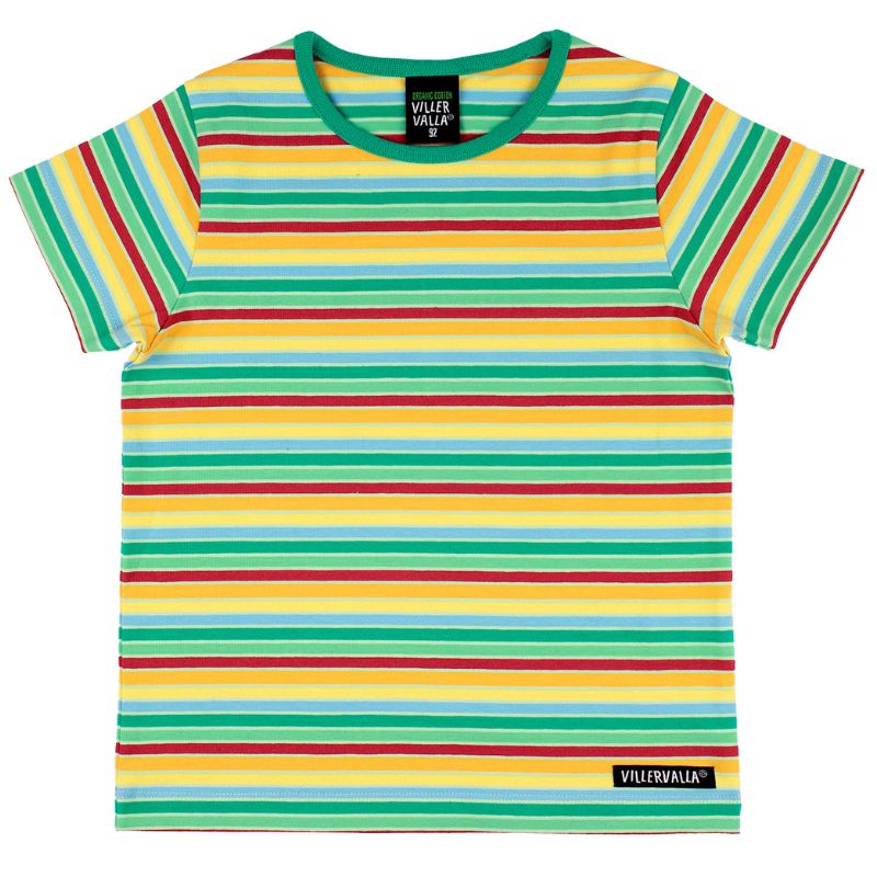 Child in a Villervalla striped shirt standing by a body of water, showing dirty hands.